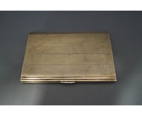 A silver cigarette case, with engine turned decoration, 193 g (6.2 troy ozs) gross