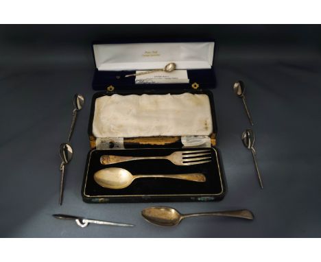 A set of five silver tea spoons, copying the Roman style, a Georgian silver teaspoon; a cased spoon and fork set; and a cased