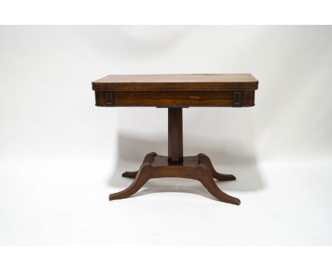 A rosewood card table with William IV crossbanded top on later mahogany base with four splayed legs, 70cm high x 91cm wide x 