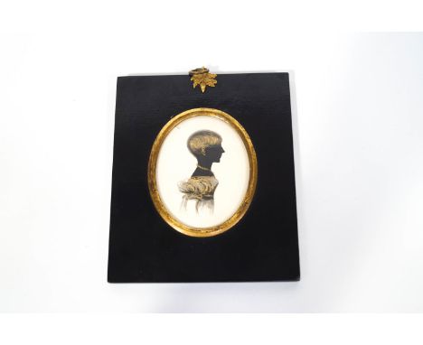 An early 19th century portrait silhouette of a young lady, watercolour and gilt highlights, framed, 8cm x 6cm