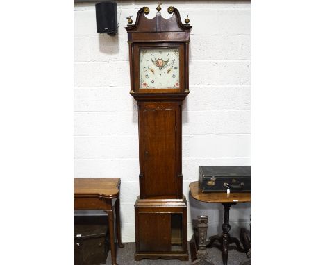 A 19th century 30 hour oak longcase clock with swan neck pediment and brass mounts, painted moonphase dial decorated with exo