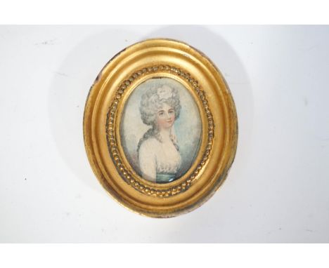 Continental school, 19th century, a  portrait miniature of a young lady wearing a white dress with blue waist, Watercolour on