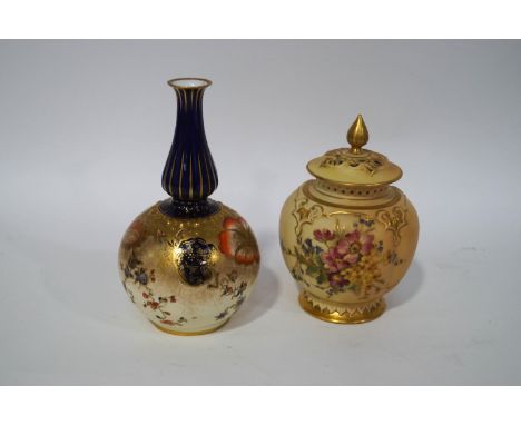 A Royal Worcester blush ivory vase and pierced cover, hand painted with flowers and gilt detail, 13.5cm high, together with a