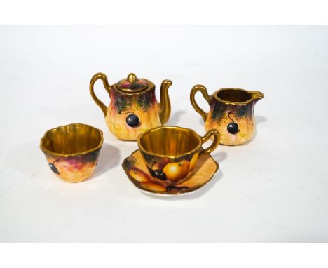 An early 20th century miniature tea set in the Worcester style, hand painted with fruit, signed Leighton