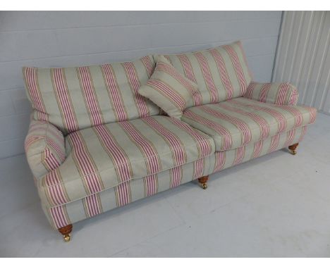 Duresta sofa with feather cushions. On turned wooden supports with castors