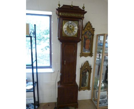 Oak Longcase clock by Sandiford of Manchester. Hood with glazed door is flanked by pilasters leading to brass ball knops