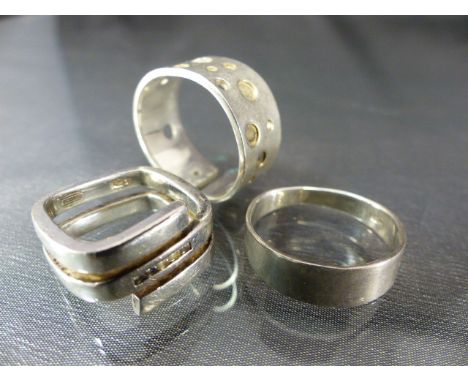 Three silver rings including one by Fossil set with five small square CZ stones