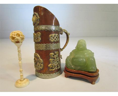 Oriental banded copper and brass water jug with lion handle and motifs along with a jade-style Buddha and one other oriental 
