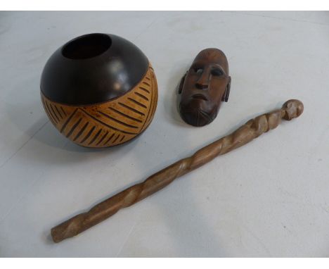 African walking stick , carved with the image of a kneeling man at top end. Small hardwood mask, carved with tribal markings 