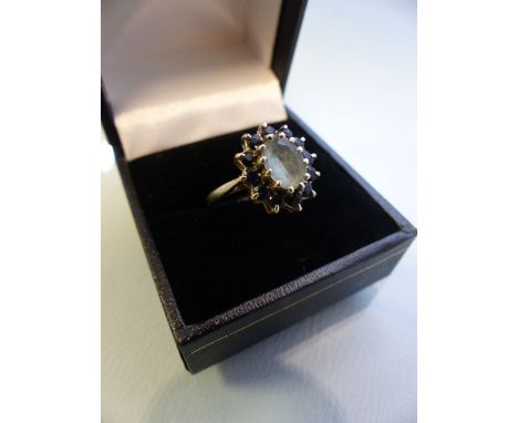 9ct white gold ladies ring Aqua Marine central stone with Sapphire surround