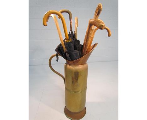 Large copper jug with selection of vintage walking sticks and umbrellas