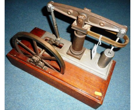 Large model single beam engine, with flywheel. Mounted on wooden base. Needs attention.   Condition Report.  44cm x 21cm x 35