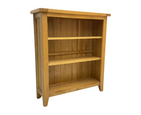 Light oak bookcase, fitted with two shelvesDimensions: Height:&nbsp;107cm&nbsp; Length/Width:&nbsp;97cm&nbsp; Depth/Diameter:
