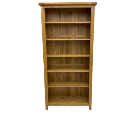 Tall light oak bookcase, fitted with five shelvesDimensions: Height:&nbsp;199cm&nbsp; Length/Width:&nbsp;96cm&nbsp; Depth/Dia