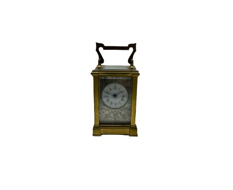 A French timepiece carriage clock in an anglaise case, lever platform escapement with timing screws, with three bevelled glas