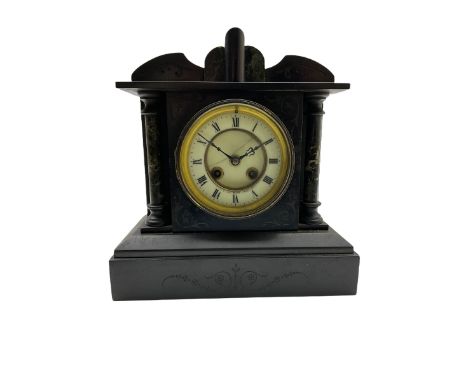 A French eight-day mantle clock striking the hours and half hours on a coiled gong, in a Belgium slate case with a shaped ped