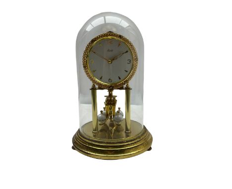 A 20th century Kundo Anniversary 400 Day clock, made by German manufacturer Kieninger & Obergfell, with a gilt brass base and