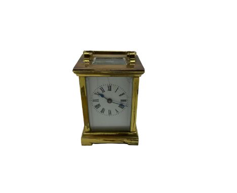 A compact late 19th century French carriage clock with a lever platform escapement, enamel dial with Roman numerals, minute m
