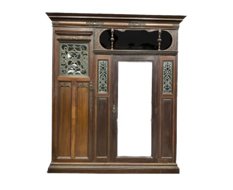 Victorian mahogany wardrobe, projecting cornice over cushion moulded frieze carved with cartouche and scrolls, the left hand 