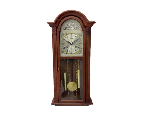 A contemporary Acctim (Anglo continental clock company) thirty-one day striking wall clock in a mahogany effect case with a f