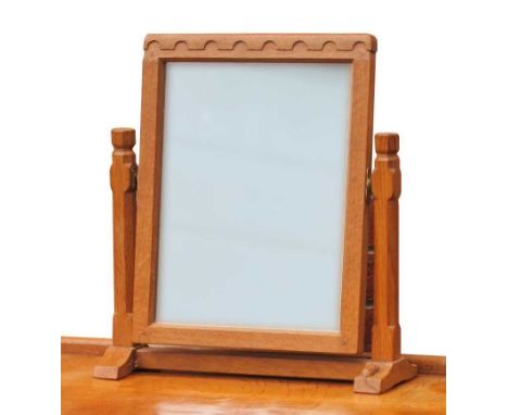 A Robert 'Mouseman' Thompson Oak Dressing Table Mirror, with arcaded frieze and octagonal block supports, carved mouse signat
