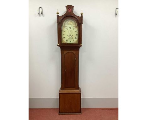 An Early XIX Century Mahogany and Oak Eight-Day Longcase Clock, the hood with shaped pediment and brass finials, arched door 