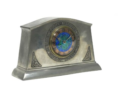 An English Pewter Mantle Clock, the circular dial with mottled blue enamel ground with copper chapter ring and Roman numerals