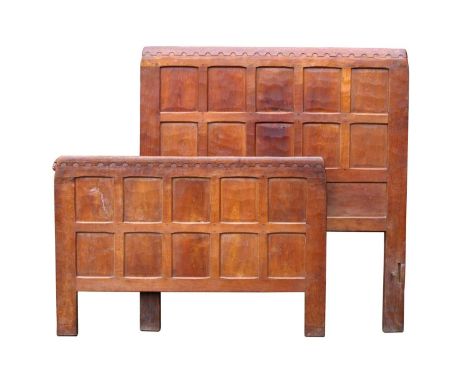A 1930's Robert 'Mouseman' Thompson Oak Single Bed, headboard and foot both with arcaded top rails and adzed panels on stile 