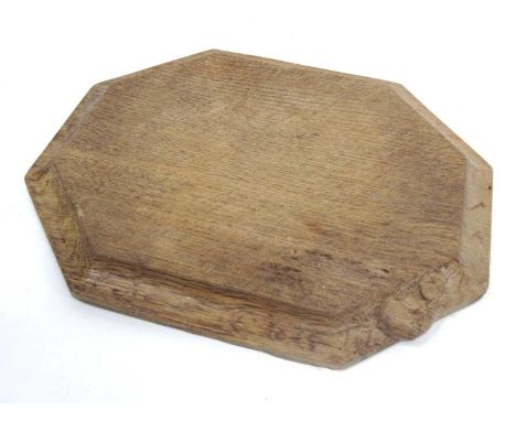 A Robert 'Mouseman' Thompson Oak Bread Board, of canted rectangular form, carved mouse signature, 30cm long.