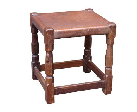An Early 1930's Robert 'Mouseman' Thompson Oak Dressing Table Stool, with brown leather seat, raised on octagonal block suppo