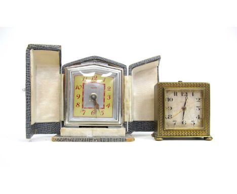A Zenith Gilt Metal Travelling Clock, of square form with engine turned decoration, 5.5cm high; A Bayard Travelling Clock (A/