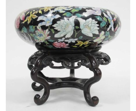 An Early XX Century Chinese Swallow Circular Bowl, decorated with colourful flowers against a black ground, seal mark, on a c