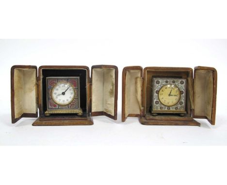 A Whytock and Sons, Dundee Eight-Day Gilt Metal and Enamel Travelling Clock, decorated with flowers and scrolls, bun feet, in