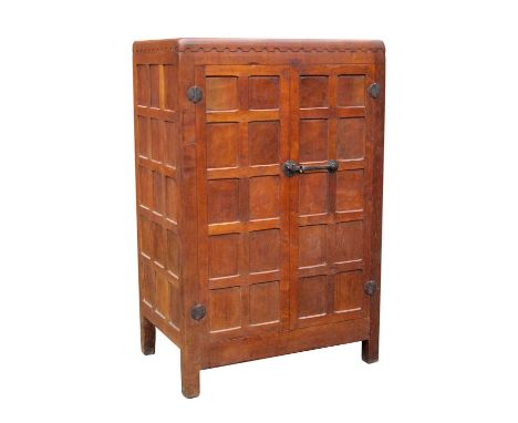 A 1930's Robert 'Mouseman' Thompson Oak Two Door Wardrobe, with arcaded frieze, adzed panelled doors and sides, internally wi