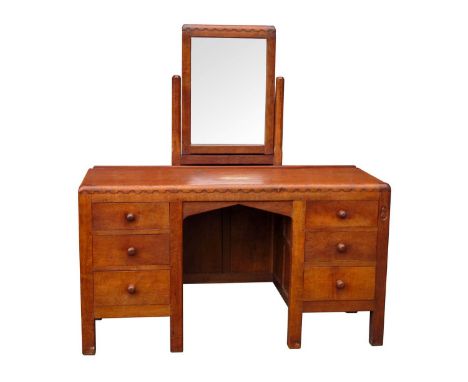 A 1930's Robert 'Mouseman' Thompson Oak Dressing Table, the central arcaded mirror on octagonal supports to adzed top and fla