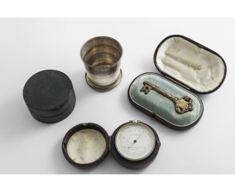 THREE CASED ITEMS:- An early 20th century American silver collapsible beaker by Gorham &amp; Co., a Victorian nickel pocket b