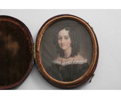 ENGLISH SCHOOL c.1830 Miniature portrait of a young lady with brown hair in ringlets and wearing black dress, on ivory, 7.25 