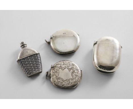 AN EDWARDIAN SILVER VESTA CASE of plain circular form, by J.H. Hillcox, Birmingham 1905, a plain oval silver vesta case by S.