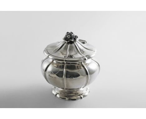 AN EARLY 19TH CENTURY TEA CADDY of baluster form, shaped circular outline with fluting, a domed cover and a flower finial, by