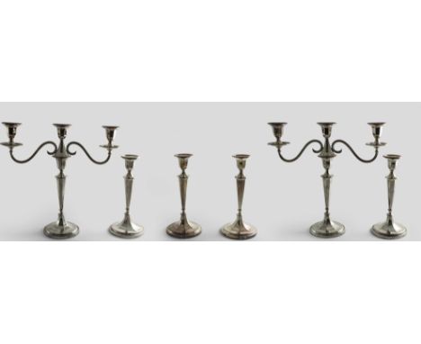 A LATE 20TH CENTURY SUITE OF FOUR CANDLESTICKS and a pair of three-light candelabra in the style of John Scofield originals, 