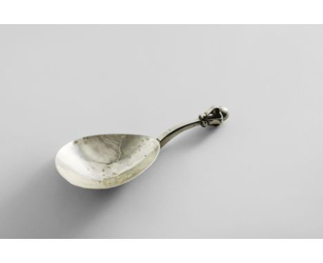 A GREAT WAR PERIOD ARTS &amp; CRAFTS CADDY SPOON with a hammered bowl, a square-section stem and an openwork finial resemblin