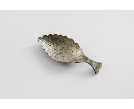 A GEORGE III CADDY SPOON The leaf-shaped bowl stamped with overlapping feather plumage, with a fish-tail handle initialled "J