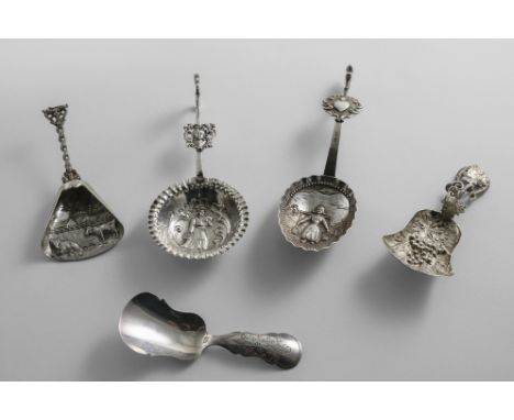 A VICTORIAN SILVER CADDY SPOON with an embossed, fan-shaped bowl and a tendril, by Hilliard &amp; Thomason, Birmingham 1859 a
