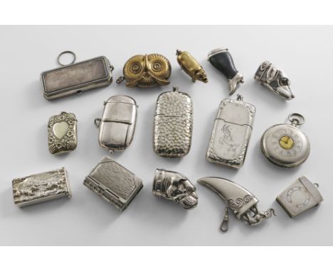 A MIXED LOT OF BRASS, NICKEL-PLATED &amp; ELECTROPLATED VESTA CASES TO INCLUDE:- An owl mask, a pig, two purse-shaped, a pock