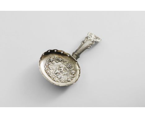 A GEORGE III CADDY SPOON with a King's pattern stem and a galleried oval bowl, stamped in the centre with a girl in a rather 