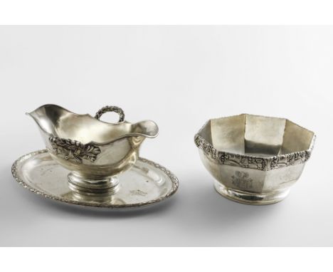 AN EARLY 20TH CENTURY GERMAN DOUBLE-LIPPED SAUCE BOAT with a detachable stand and laurel leaf borders, engraved with the Duca