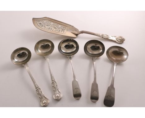 A PAIR OF GEORGE III SILVER FIDDLE PATTERN SAUCE LADLES crested, by Thomas Barker, London 1811, an Irish silver Fiddle patter