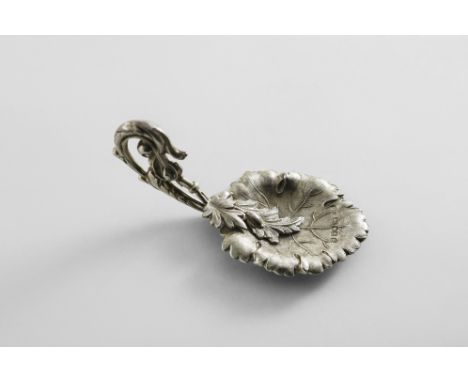 A VICTORIAN CADDY SPOON with a stamped leaf bowl, overlapped by two small leaves and berries, the handle in the form of a lar