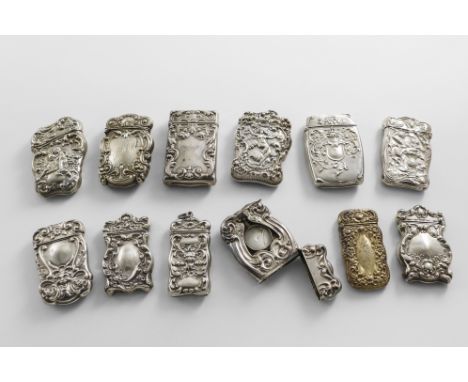 TWELVE LATE 19TH / EARLY 20TH CENTURY NORTH AMERICAN SILVER ART NOUVEAU VESTA CASES with embossed decoration (including a pla