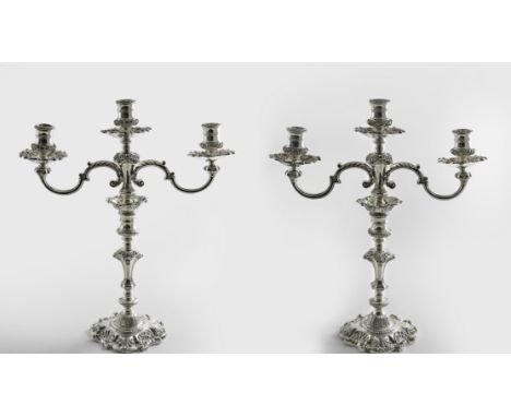 A PAIR OF LATE 20TH CENTURY CAST THREE-LIGHT CANDELABRA in the style of a pair from the 1740's with matted shells in relief, 